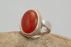 Beautiful Carnelian Agate Ring from my Crown Jewels Series in Sterling Silver and 18k Gold. This ring is hand fabricated to give excellent detail and durability. You can also order this with other gemstone as well. Elegant Ruby Ring With Polished Agate, Anniversary Agate Rings With Polished Finish, Anniversary Carnelian Rings With Polished Finish, Anniversary Chalcedony Ring With Polished Finish, Elegant Agate Ruby Ring With Polished Finish, Polished Carnelian Oval Rings, Elegant Carnelian Rings With Polished Finish, Classic Carnelian Rings With Polished Finish, Handmade Classic Carnelian Ring