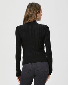 This black long sleeve high neck top is made from an incredibly soft and comfortable ribbed knit material with a flattering stitch detail at the waistline. Pair the Raisa Top with any shade of denim in your closet. Sleek Black Long Sleeve Turtleneck, Sleek Black Mock Neck Top For Fall, Stretch Black Turtleneck, Chic Black Fine Knit Turtleneck, Ribbed High Neck Knit Top For Fall, Black Ribbed Turtleneck For Fall, Fall Black Turtleneck With Ribbed Neckline, Black Stretch Turtleneck With Fine Knit, Black Stretch Fine Knit Turtleneck