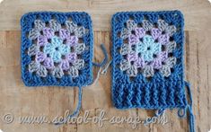 two crocheted squares sitting on top of a wooden table