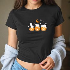 Black Cat Crop Top, Halloween Pumpkin Baby Tee, Spooky Season Baby Tee,Trendy Halloween Baby Tee, Horror Crop Top, Scary Fall Crop Top, T104 🌸 Welcome to Pinky Tee Store! We strive to provide you with the best shopping experience possible. Thank you for choosing us!" 👉 Ordering Process: 📸 Thoroughly examine all the available photos. 📏 Select your item's size. 🎨 Choose your preferred color. 🔢 Specify the desired quantity. 🛒 Add the selected item to your cart. 💳 Proceed to checkout to finalize your order. 👉 Product Features: Sweatshirts: 👕 Made from a blend of 50% cotton and 50% polyester. 🧵 Features a 1x1 ribbed collar, cuffs, and spandex waistband for added durability. 🚻 Unisex size. Shirts: 👕 Unisex t-shirt that fits like a cherished favorite, with a crew neck made from super Fall Crop, Trendy Halloween, Baby In Pumpkin, Girl Falling, Baby Halloween, Infant Tees, Halloween Pumpkins, Girl Gifts, Black Cat