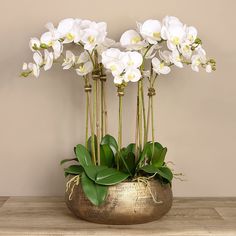 large orchid arrangement centerpiece in stunning gold ceramic planter Orchid Interior, Agency Office, Gold Planter, Dining Room Table Centerpieces, Exotic Orchids