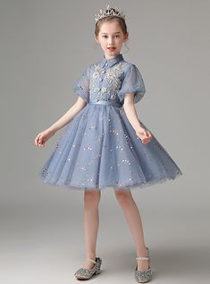 Dress her in sparkling beading for a variety of cherished events, such as communion, wedding flower girl, birthday celebration, or an elegant tea party. For this Blue Tulle Sequins Short Sleeve Flower Girl Dress, a captivating creation that will perfectly complement any and all of your special occasions. Elegant Light Blue Princess Dress For Spring, Light Blue Elegant Tutu Dress For Wedding, Elegant Light Blue Tutu Dress For Wedding, Elegant Light Blue Princess Dress For Wedding, Elegant Light Blue Princess Wedding Dress, Elegant Light Blue Wedding Tutu Dress, Elegant First Communion Dress With Short Sleeves For Pageants, Princess Style Short Sleeve Dress For Confirmation, Princess Style Spring First Communion Dress