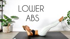 a woman doing an exercise on a mat with the words lower abss above her