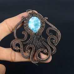 Handmade Copper Chain Size 18-20Inch - https://www.etsy.com/in-en/listing/1162990726 Welcome to our little shop, where you can find handmade copper wire jewelry and more, for you and your loved ones. We do accept custom orders also, kindly message us for more. Octopus Larimar Pendant Larimar Gemstone Pendant Copper Wire Wrapped Pendant Necklace Larimar Jewelry Gift For Her Mother Animal Jewelry Gemstone : Larimar Metal : Copper Benefits Of Wearing Larimar : It is considered by some to aid in com Handmade Turquoise Larimar Jewelry, Handmade Aquamarine Pendant Necklace, Handmade Blue Larimar Jewelry, Handmade Aquamarine Pendant Jewelry, Handmade Larimar Jewelry, Handmade Unique Larimar Jewelry, Copper Benefits, Copper Wire Jewelry, Larimar Jewelry