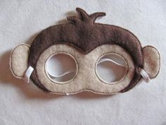 a monkey mask with two holes in the middle