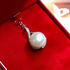 "Jewelry is the one thing that has the power to make you feel absolutely unique and elegant. Dazzle yourself and everyone around you with this cute and lustrous South Sea Pearl pendant. Featuring a RARE, LUSTROUS 12 mm Natural, Round, White South Sea Pearl, accented by 15 pieces of Brilliant Round diamonds weighing at 0.10 carat. Set in 18K solid white gold, handcrafted by professional goldsmith. All gems have been selected and graded for their unsurpassed quality and authenticity. FOR MATCHING White Gold Sterling Silver Pearl Pendant Jewelry, Sterling Silver White Gold Jewelry With Pearl Pendant, Exquisite Pearl White Pearl Necklace Gift, Exquisite Pearl White Pearl Necklace As Gift, Exquisite Pearl White Pearl Necklace For Gift, Luxury Pearl Pendant Jewelry Gift, White Pearl Pendant Necklace For Her, Diamond White Necklace With Pearl Charm As Gift, Akoya Pearl Pendant Necklace Gift