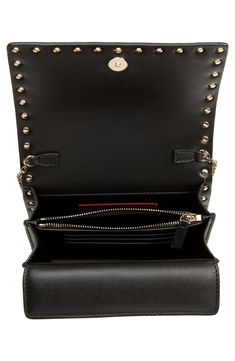 This pyramid-studded calfskin bag opens to reveal a well-organized interior with dual compartments, card slots and another magnetic pocket beneath the flap. Style Name:Valentino Garavani Rockstud Leather Wallet On A Chain. Style Number: 6094824. Luxury Crossbody Shoulder Bag With Card Slots, Leather Evening Bags With Card Slots, Designer Leather Wallet On Chain, Luxury Leather Wallet On Chain With Removable Pouch, Designer Leather Wallet On Chain With Palladium Hardware, Luxury Leather Wallet With Detachable Strap, Designer Leather Wallets With Detachable Strap, Evening Leather Shoulder Bag With Interior Card Slots, Formal Leather Shoulder Bag With Card Slots