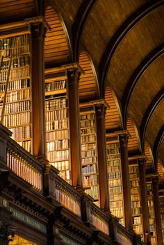 the inside of a library with many bookshelves