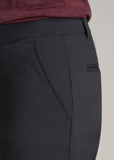 About Our Men's Tall Pants These extra-long chinos strike the perfect balance between classic and comfortable. They're designed to look like a pair of tapered chinos but are made of a lighter stretchy fabric that provides plenty of room for movement so you can tee off on the golf course, take the dog for a walk or grab dinner with friends at that new restaurant in town. We know how hard it is to find men's tall pants, which is why we made sure this pair had an extra-long inseam measured specific Black Chinos With Welt Pockets For Business, Business Black Chinos With Welt Pockets, Black Straight Chinos For Business, Tailored Black Chinos With Welt Pockets, Black Tapered Leg Chinos For Business, Black Tapered Leg Chinos For Business Casual, Business Casual Black Chinos With Welt Pockets, Classic Black Pants With Hidden Pockets, Classic Black Ankle-length Work Pants