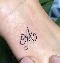 a person with a small tattoo on their foot