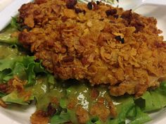 a close up of a plate of food with lettuce and meat on it