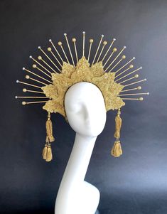 "Sun Goddess Crown Headband with Crystals, Halo Headpiece, Bridal Headdress, Virgin Mary, Saints, Burning Man, 6\" Gold Spikes, Gold Tassels A perfect halo crown just for you! This crown is lovingly handmade and very sturdy. Each spike is drilled into the headband and then anchored. Then I have carefully wrapped and woven them to be completely secured. These are not just stuck onto the top of the headband with glue. It is a long process to make these headbands perfect! These are made of wood and Traditional Fitted Headpiece For Costume, Traditional Carnival Costume Headpieces, Traditional Gold Headpieces For Carnival, Gold Fitted Festival Headpiece, Traditional Headpieces For Costume Festivals, Traditional Fitted Headpiece For Festivals, Traditional Festival Costume Headpieces, Handmade Gold Costume Headpiece, Handmade Gold Headpiece For Costume