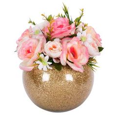 a gold vase filled with pink and white flowers