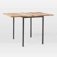 a wooden table with metal legs and a square top on an isolated white background,