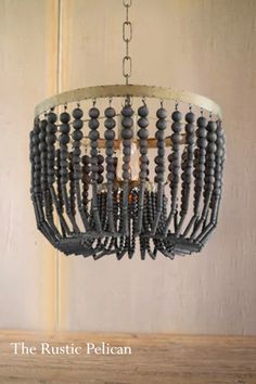 the rustic pelican chandelier is made from wood beads