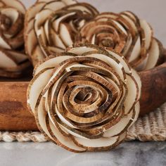 several pieces of wood that have been carved into flowers