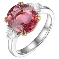 This ring features a oval cut 4.47 carat pink tourmaline, assented with 2 fancy cut diamonds on the shoulder. Each diamond weight 0.24 carat. The two diamonds are E color and VS clarity. A modern yet classic design. Tourmaline is set in 18 karat yellow gold with a double claw prong setting and the rest of the ring is in 18 karat white gold. US 6.5 Resizing is available Pink tourmaline 4.47 carat Fancy Diamond 0.48 carat Gia Certified Oval Pink Diamond Ring, Luxury Pink Topaz Ring With Diamond, Oval Pink Gia Certified Diamond Ring, Luxury Oval Three-stone Ruby Ring, Gia Certified Oval Pink Ruby Ring, Elegant Pink Ruby Three Stone Ring, Luxury Pink Topaz Ring For Formal Occasions, Pink Three Stone Ruby Ring, Elegant Pink Three-stone Ruby Ring