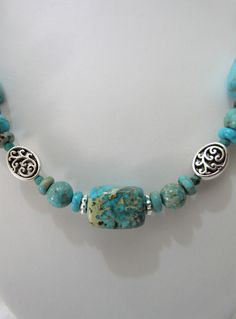 This necklace is a blend of turquoise and turquoise jasper ( don't know for sure what that term means but that is how the beads were labeled and they were pricy). Pewter fillegree ovals and silver plated rondelles were used as spacers. The necklace is 20 inches long with a 3 inch extender. The swivel lobster clasp is silver plated. The earrings dangle one inch from the loops of the silver plated ear wires and are made with 8mm and 6mm rounds and pewter beads. This set will be slipped into an org Adjustable Jasper Jewelry In Turquoise, Adjustable Turquoise Jewelry With Lobster Clasp, Unique Turquoise Jasper Jewelry, Turquoise Necklace With Lobster Clasp For Jewelry Making, Turquoise Jasper Jewelry With Natural Stones, Turquoise Spiritual Hypoallergenic Jewelry, Turquoise Jasper Round Bead Jewelry, Turquoise Jasper Jewelry For Jewelry Making, Turquoise Jasper For Jewelry Making