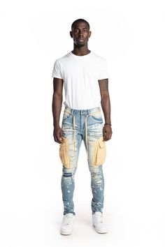 - Slim tapered fit - 98% Cotton, 2% Spandex- Brighton blue- Heavy bleached washing- Stretchy cargo jeans that narrow towards the ankle- Antique silver button with 'Smoke Rise' logo- Twill waist string- 3D cargo pocket with hidden snap button closure- Rip and Repair detail Luxury Blue Cargo Jeans With Five Pockets, Luxury Washed Blue Cargo Jeans With Pockets, Luxury Mid-rise Rigid Denim Cargo Jeans, Cargo Fashion, Luxury Washed Blue Cotton Cargo Jeans, Rise Logo, Rugged Five-pocket Jeans In Rigid Denim, Fashion Jeans, Cargo Pocket