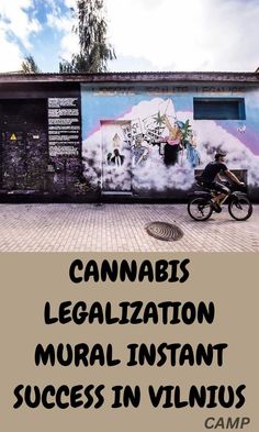 a man riding a bike next to a wall with graffiti on it and the words cannabiss legalization rural instant success in vilnius