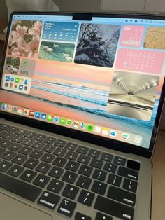 an open laptop computer sitting on top of a wooden desk