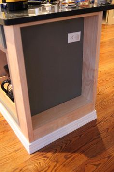 a kitchen island with a wine rack in the middle