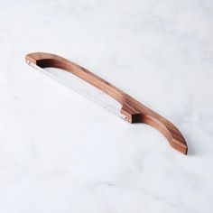 a wooden handle on a marble counter top