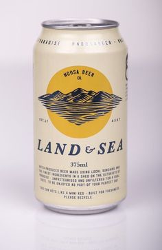 a can of land and sea beer on a white surface