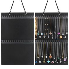 a black wall hanging jewelry organizer with multiple necklaces and charms on it's sides