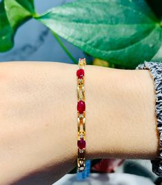 Stunning Vintage 14K Yellow Gold Diamond Ruby Bracelet: Stunning Genuine Diamonds and Natural Ruby 11 pc oval shape 6x4mm Ruby(s): 7.50CT Diamond(s): 0.28CT Color: G Clarity: SI2 Total Bracelet Weight: 11.0GR Bracelet Length: 7in Bracelet Width: 1/2cm 14K Yellow Gold For more information regarding this item feel free to reach me so I can accommodate your needs. Thank you Gold Oval Bracelet With Gemstone, Oval Gold Bracelet With Gemstone For Anniversary, Oval Ruby Bracelet In Gold, Gold Oval Ruby Bracelets, Oval Gold Ruby Bracelets, Oval 14k Gold Bracelet, Formal Oval Gold Bracelet, Oval Gold Bracelet For Anniversary, Mens Diamond Wedding Bands