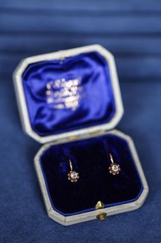 A beautiful and original pair of solid yellow gold buttercup earrings set with a sparkling pair of natural European antique cut diamonds. High quality originals made in Berlin, Germany and fitted with the original royal blue velvet box. These earrings are perfect antique diamond earrings for everyday wear. Elegant and timeless and easy to wear. The hooks and the clips are in excellent wearable condition.  This pair of earrings will be beautifully packaged for safe delivery with complimentary del Classic Hallmarked Yellow Gold Diamond Earrings, Classic Formal Earrings With Rose Cut Diamonds, Classic Gold Diamond Earrings For Gift, Classic Rose Cut Diamonds Jewelry Gift, Classic Gold Diamond Earrings As Gift, Classic Rose Cut Diamonds Jewelry As Gift, Formal 14k Gold Earrings With Rose Cut Diamonds, Classic Gold Earrings With Rose Cut Diamonds, Diamond Cut Yellow Gold Earrings As Gift