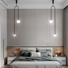 a modern bedroom with grey walls and white bedding, hanging lights over the headboard