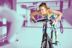 a woman on a stationary bike in a gym