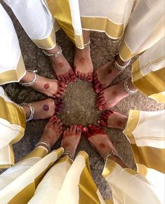 several feet with rings on them standing in a circle