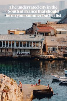 people are standing on the dock in front of some buildings and water with text overlay that reads, the underrated city in the south of france that should be on your summer bucket list