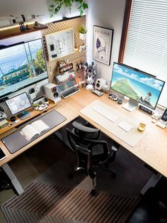 an office desk with two monitors, keyboard and mouse