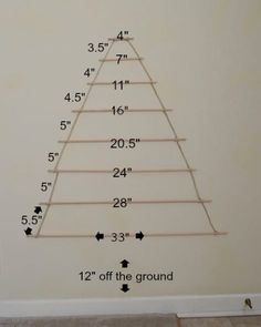 the height of a christmas tree is shown in this room with measurements for each branch