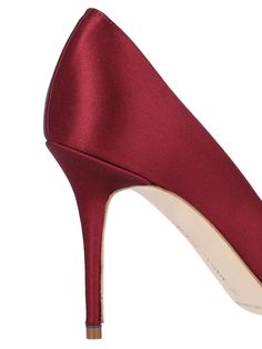 Manolo Blahnik 'Nadira' red satin pumps with upper crystal leaf detail toe, slip on fit, stiletto heels and a leather sole. Formal High Heel Heels With Satin Lining, Formal High Heels With Satin Lining, Elegant Court Shoes With Red Sole, Elegant Closed Toe Court Shoes With Red Sole, Elegant Court Shoes With Red Sole And Closed Toe, Party Heels With Satin Lining, Elegant Red Almond Toe Court Shoes, Elegant Red Heels For Gala, Elegant Satin Heels For Evening