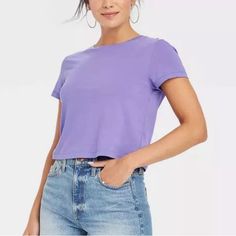 This 100% Cotton Short Sleeve T-Shirt In A Pretty Lavender Purple Color Is Slightly Cropped; This Shirt Is Brand New, Never Been Worn. Super Soft! Size Large Approx. Measurements When Laying Flat: Pit To Pit - 20” Shoulder To Hem - 20” This Qualifies For My 3 For $30 Deal. Add This Item To Your Bundle With 2 Other Items That Also Qualify And I Will Offer The $30 Deal And Discount The Shipping! If You Have Any Questions At All, Please Feel Free To Message Me. Thank You For Shopping My Closet! Don Trendy Solid Purple Top, Trendy Purple Solid Color Top, Purple Solid Cotton Top, Purple Solid Color Cotton Top, Purple Relaxed Fit Casual Top, Lavender Crew Neck T-shirt For Summer, Trendy Lavender Short Sleeve T-shirt, Purple Plain Short Sleeve Top, Lavender Short Sleeve T-shirt For Summer