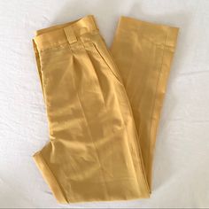 Deadstock American Apparel Micro-Poly High-Waist Pleated Pants In Golden Poppy Excellent/Like New Condition. Never Worn. Pleated High-Waisted Tailored Trousers In Light Yellow. Classic High Rise, Slim Fit, Straight Leg, Front Pleats, Back Darts, Front Zip, Belt Loops And Side Pockets. Smooth Micro-Poly Material. 100% Polyester. Size Medium Measurements Flat (Approx): Waist: 14.5“ / Hip: 21“ / Front Rise: 13“ / Inseam: 30“ / Leg Opening: 7“ Fitted Solid Color Work Pants For Summer, Fitted Work Pants For Summer, High Waist Work Pants For Summer, High Waist Summer Work Pants, Summer High-waisted Work Pants, Tailored Work Pants With Belt Loops For Spring, Chic Mustard Wide Leg Pants, Fitted Work Pants With Belt Loops For Spring, Retro Trousers For Workwear