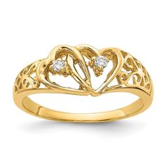 a yellow gold ring with two hearts and diamonds in the middle, on a white background