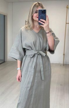 Introducing our beautiful linen maxi dress with a flattering v-neckline. This breezy and elegant dress is perfect for any occasion, whether you're heading to a summer wedding or a casual afternoon out. The soft and breathable linen fabric will keep you cool and comfortable all day long, while the v-neck adds a touch of sophistication. Pair it with heels for a dressed up look, or sandals for a more relaxed vibe. This versatile dress is a must-have addition to your wardrobe! Model wearing size s h Vacation Linen Midi Dress With Tie Waist, Linen Midi Dress With Tie Waist For Vacation, Casual V-neck Linen Dress For Brunch, Spring Beach Linen Dress With Belt, Belted Linen Dress For Spring Vacation, Elegant Linen V-neck Dress For Spring, V-neck Linen Dress For Vacation, Elegant Linen Dress With Tie Waist For Vacation, Elegant V-neck Dress With Tie Waist For Beach