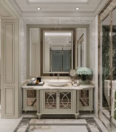 an elegant bathroom with marble floors and walls