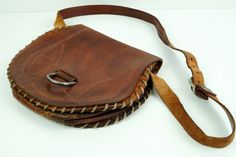 Vintage Embossed Genuine Leather Bag, Shoulder Bag, Handmade Handbag, Nordic bag, Saddle Bag, Brown Leather Handbag. Very rare Boho bag. Cognac color bag This lovely bag is made from thick leather. Mid tan leather and Embossed patterns on front and at the back Has medium length shoulder strap, the inside is not lined and has two large compartment . Closes with with Poppers Great collectible bag. Very rare find. Good vintage condition for its age with normal marks, wear and rubbing nothing major Leather Bag Handmade, Shoulder Bag Vintage, Brown Leather Handbags, Handmade Handbags, Leather Bags Handmade, Genuine Leather Bags, Boho Bag, Bag Handmade, Bag Vintage