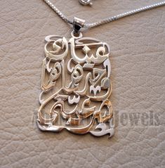 "Love pendant with famous poem verse sterling silver 925 jewelry Arabic \" Your eyes alone are my legitimacy \"عيناك وحدهما هما شرعيتي قصيدة مشهورة للشاعر الكبير نزار قباني عيناك وحدهما هما شَرعيَّتي مراكبي، وصديقتا أسفـاري إن كان لي وطنٌ، فوجهُك موطني أو كان لي دارٌ ، فحبك داري من ذا يحاسبني عليك وأنت لي هبةُ السماء ونعمةُ الأقدارِ؟ من ذا يُقاضيني وأنت قضيتي ورفيقُ أحلامي، وضوءُ نهاري من ذا يهددني وأنت حضارتي وثقافتي، وكتابتي، ومناري Arabic poem verse says : Your eyes alone are my legitimacy My Calligraphy Name, Map Pendant, Famous Poems, Love Pendant, 925 Jewelry, High Quality Jewelry, Custom Rings, Your Eyes, Pendant Necklaces