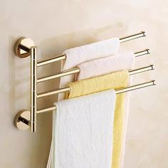 three towels are hanging on a towel rack