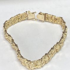 Estate 14k Yellow Gold Nugget Bracelet! Excellent Pre-owned Condition!!! Recently professionally polished, bracelet shows no visible signs of wear. Weight: 27.1g Length: 8” over all Gauge: 9.5mm wide Hallmarked: 14k All items are preowned and might show appropriate signs of age or wear. Item you see in the pictures is the actual item you are getting. lease look at the pictures carefully and use your own judgment before bidding Feel free to Ask any additional questions ALL SALES ARE FINAL NO RETURNS INSURED DOMESTIC SHIPPING ONLY Shipped with USPS First Class Package. Bracelets Gold For Men, Gold Nugget Jewelry, Custom Gold Jewelry, Xoxo Jewelry, Dope Jewelry Accessories, Nugget Bracelet, Solid Gold Bracelet, Gold Teeth, Mens Gold Jewelry