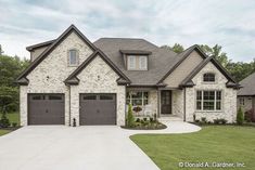 a large house with two garages in the front yard