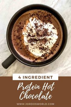 a hot chocolate drink with whipped cream and chocolate shavings in the top half