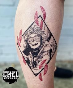 a woman's leg with an image of a clown on it and some feathers